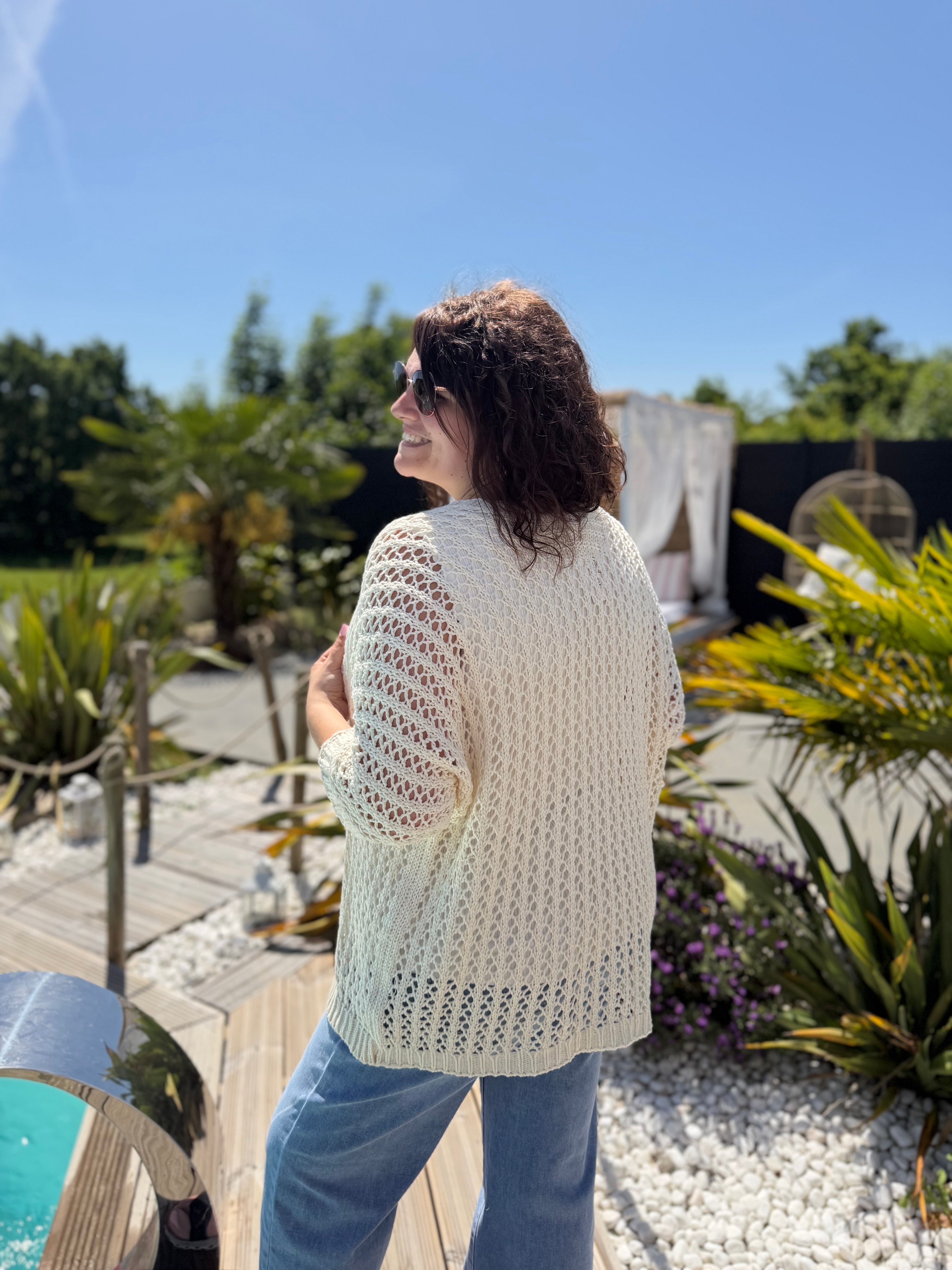 Le gilet en maille beige
