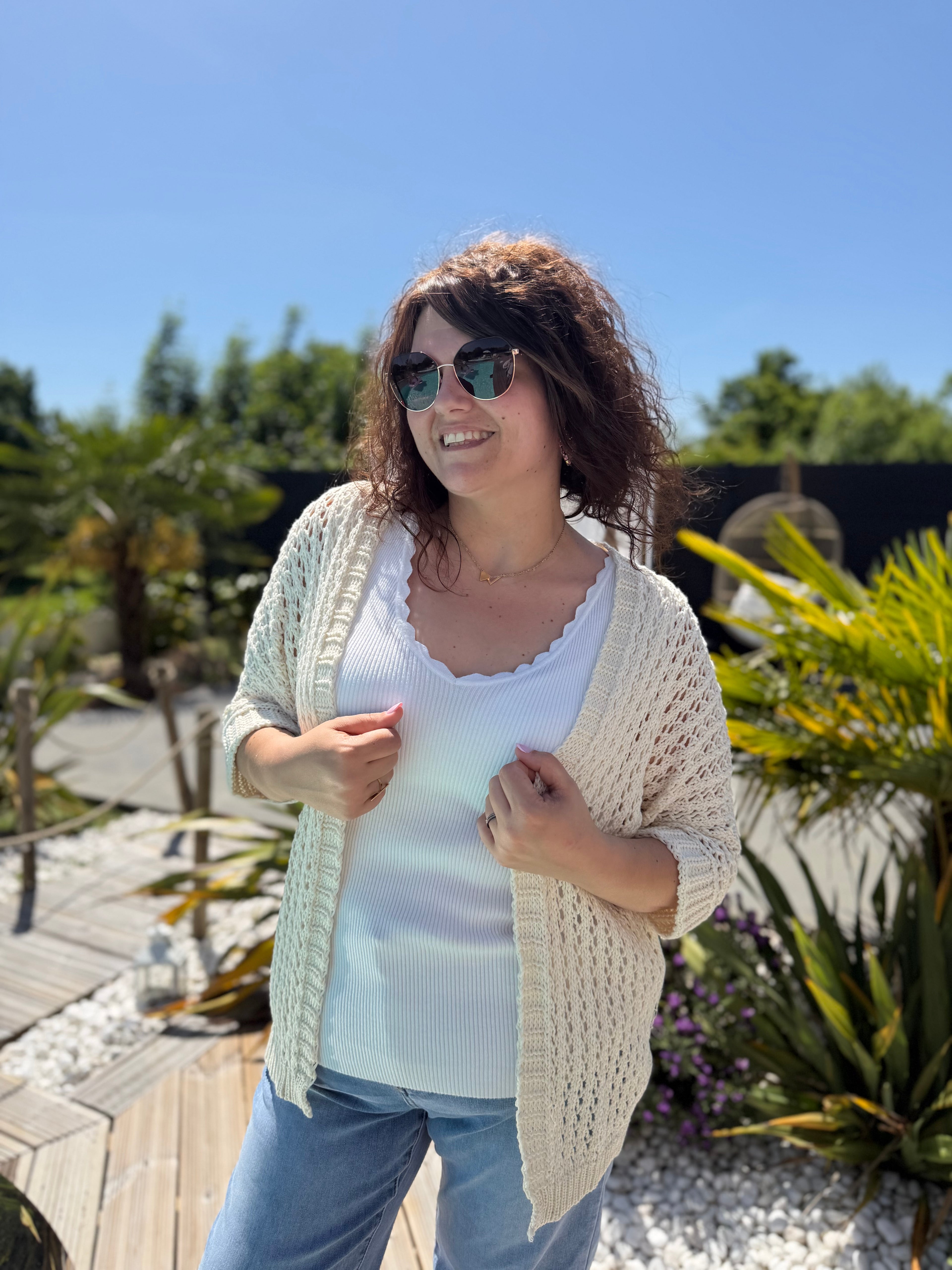 Le gilet en maille beige